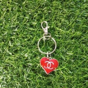 red heart charm with silve tone hardware logo keychain style